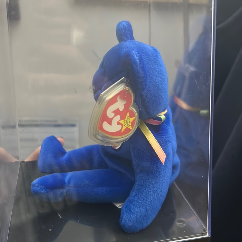 Official club beanie baby in pristine casing with covered tag